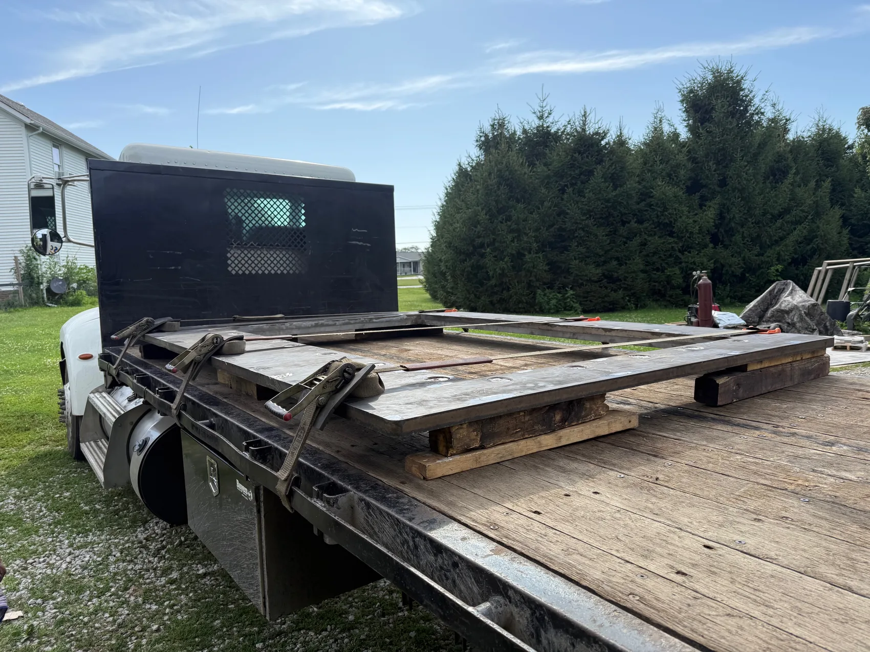 A finished door strapped to the flatbed and headed out - where it had to seal on the first set, no coming back down to re-weld.