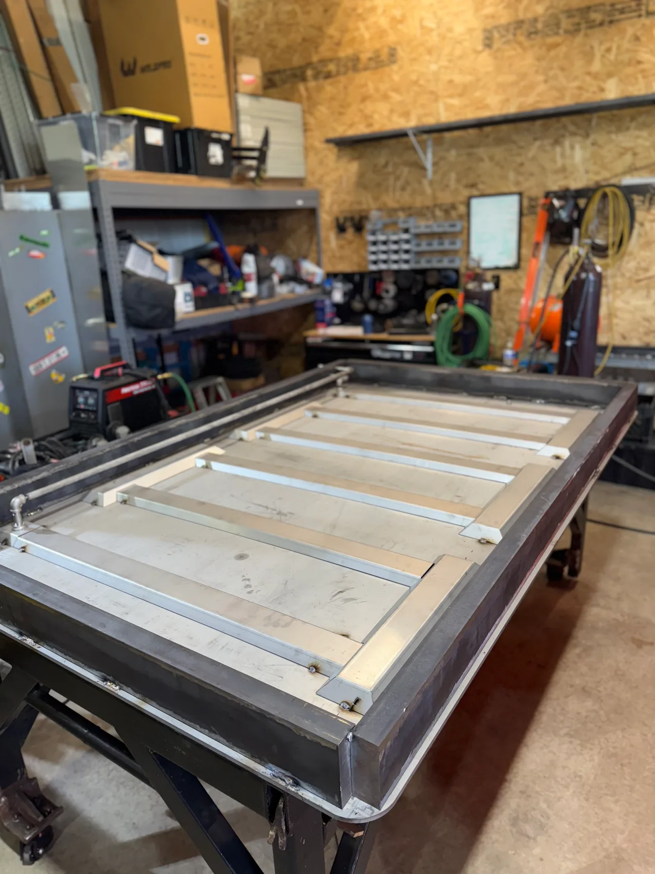 Steel door weldment fit-up on the welding table