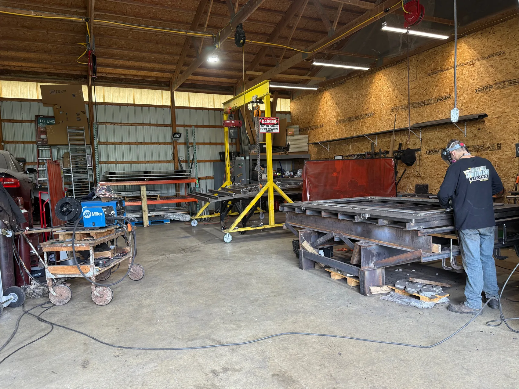 Welder fabricating a large weldment under the gantry