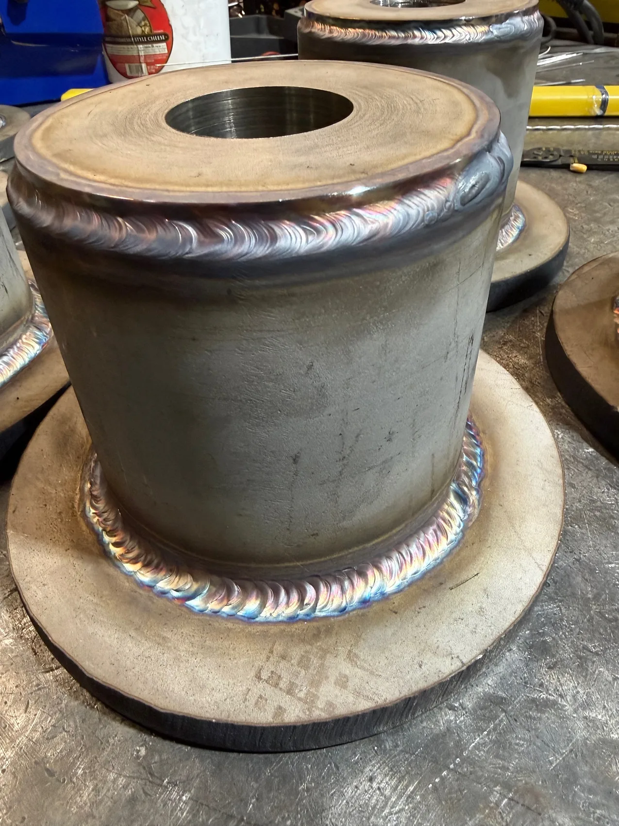 Rainbow TIG welds on a stainless pulley hub