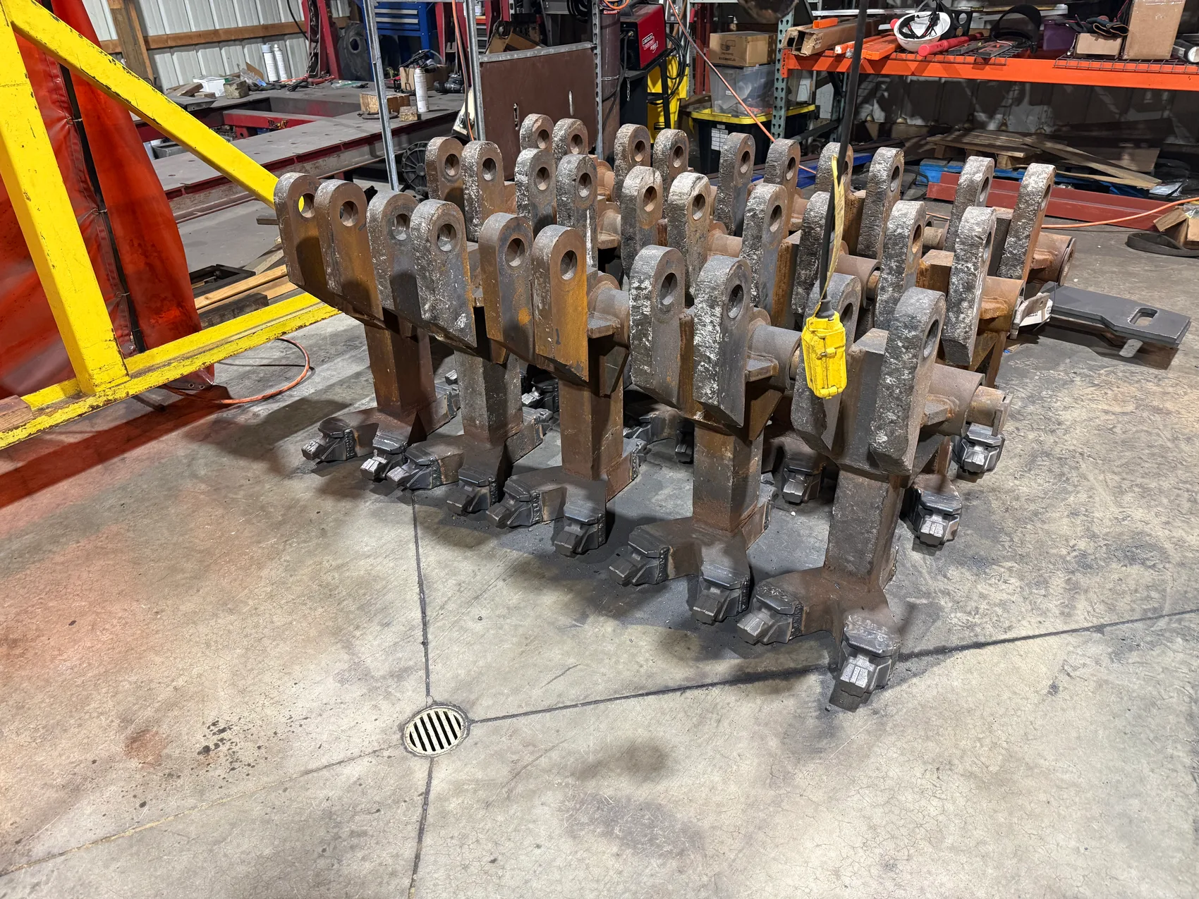 Forged links staged on the shop floor