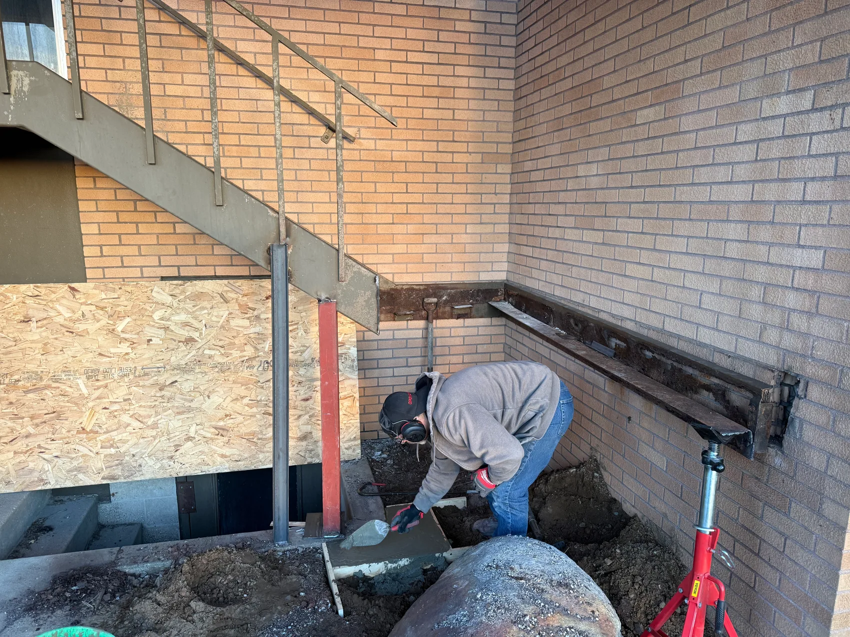 Setting the new steel ledger at the base