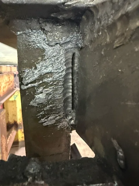 Multi-pass structural weld joining members 2-3 inches thick - laid in by our top welder to carry the real operating loads.