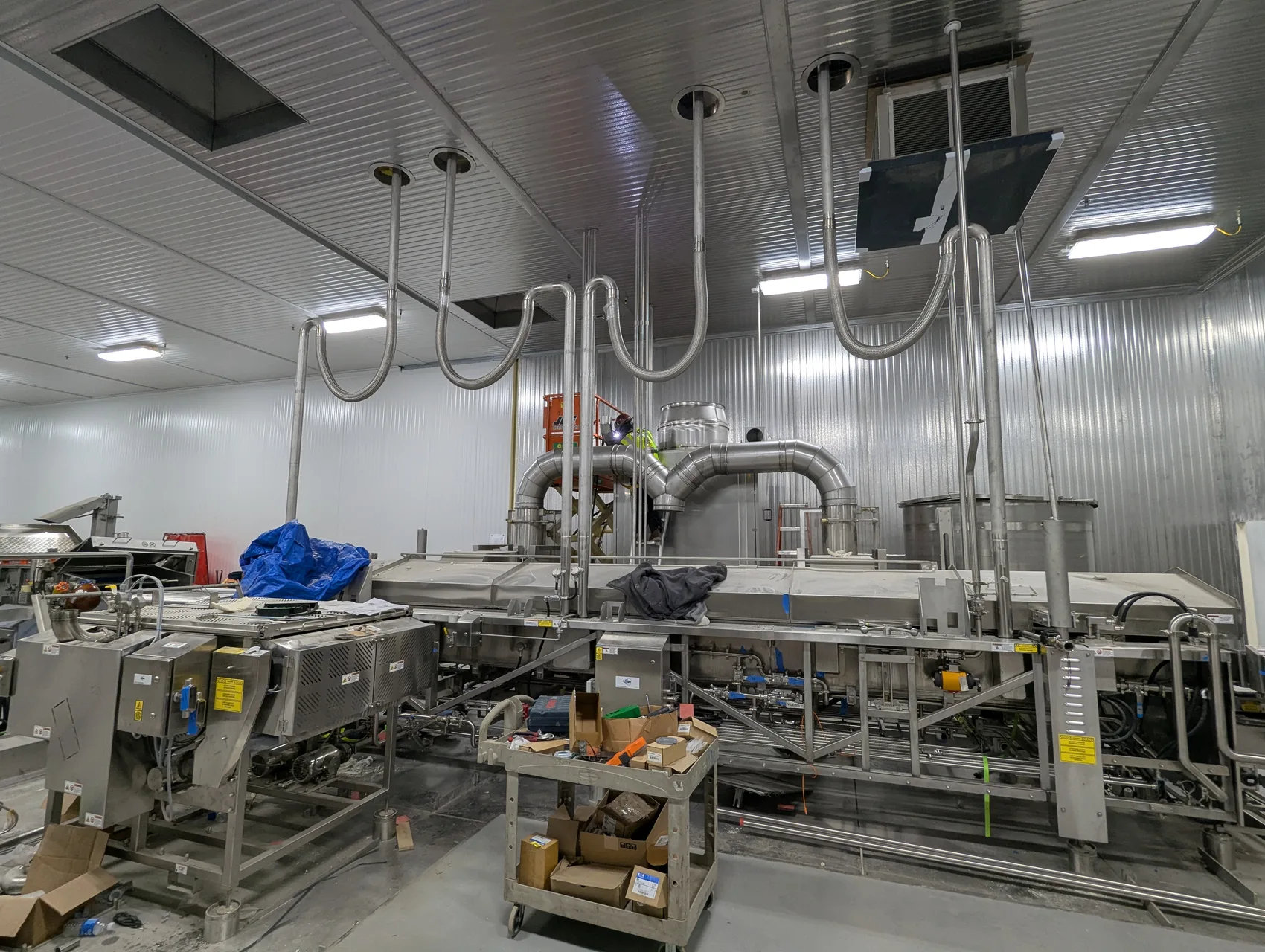 Tall stainless steel food-grade processing unit and exhaust ductwork by Sons of Thunder Welding